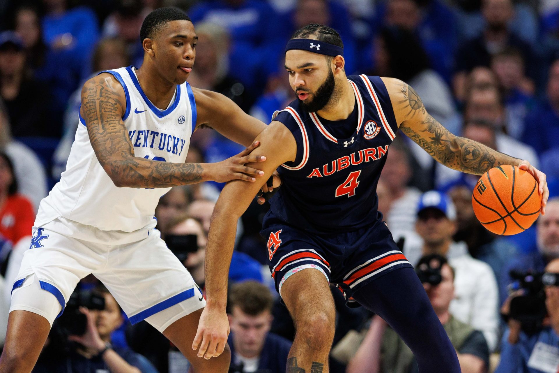 Lexington, Kentucky, USA; Auburn Tigers forward Johni Broome (4) handles the ball against Kentucky Wildcats forward Brandon Garrison (10) during the second half at Rupp Arena