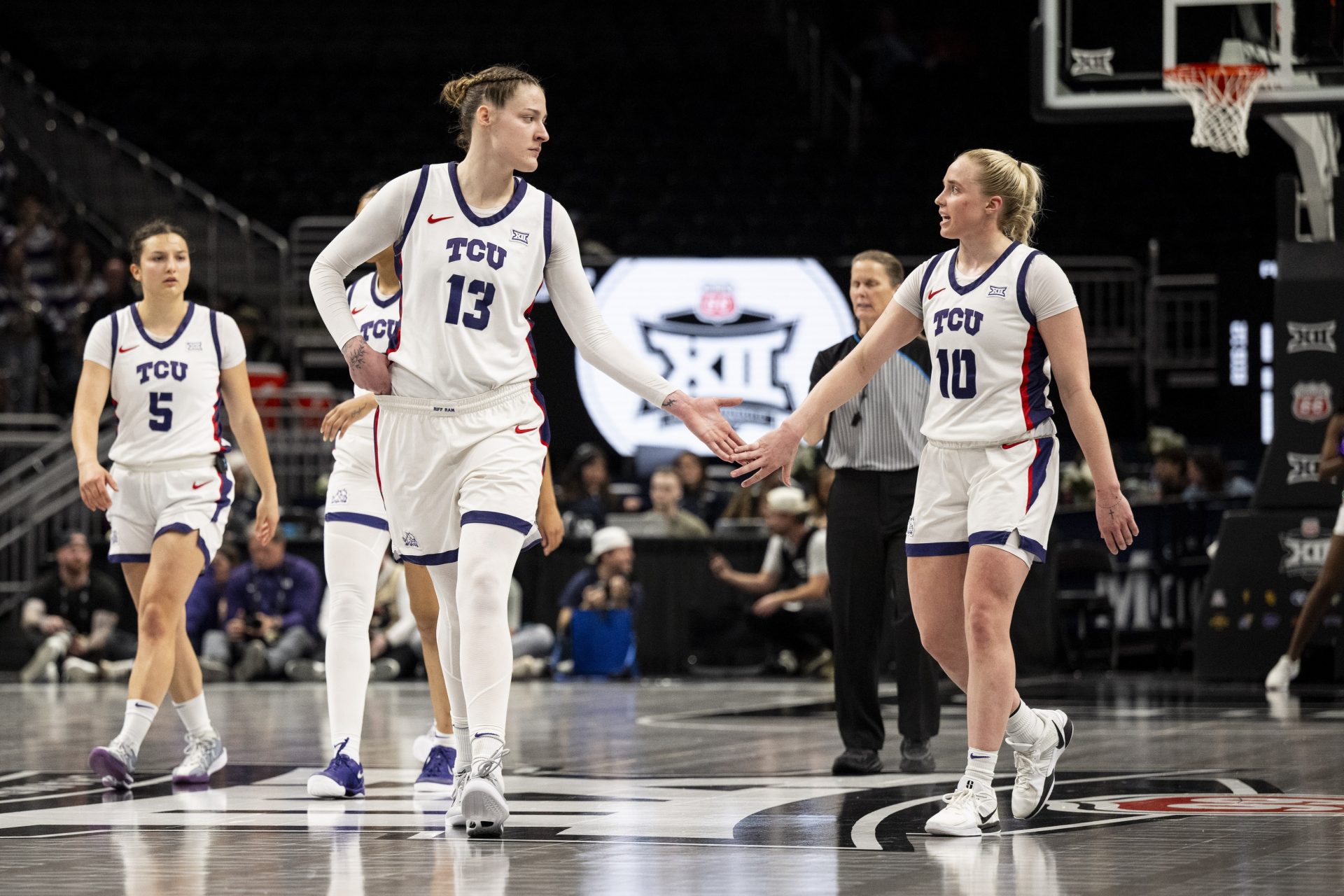 TCU Horned Frogs center Sedona Prince (13) and guard Hailey Van Lith (10) high five during the third quarter against the Colorado Buffaloes at T-Mobile Center.