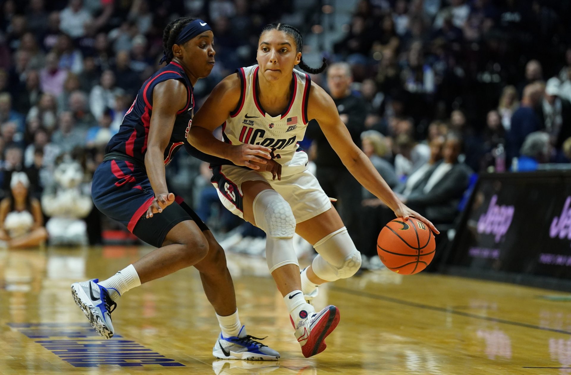 UConn Huskies guard Azzi Fudd (35) returns the ball against the St. John's Red Storm in the first half at Mohegan Sun Arena.