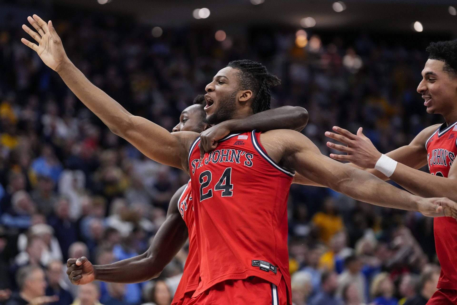 St. John’s Red Storm forward Zuby Ejiofor (24) celebrates after making the game winning shot in overtime against the Marquette Golden Eagles