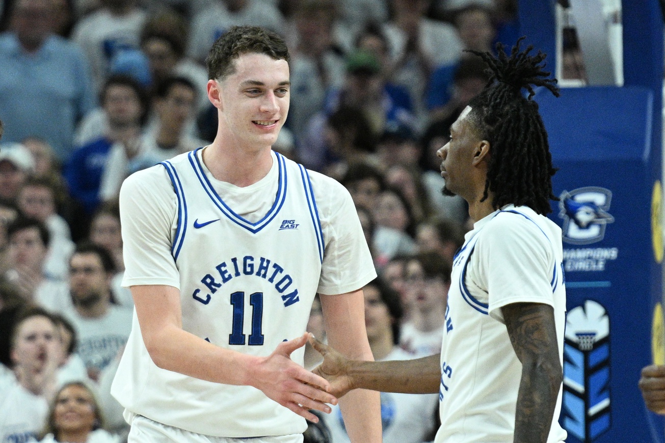 Creighton Bluejays center Ryan Kalkbrenner (11) greets guard Jamiya Neal (5) after scoring against the Butler Bulldogs during the first half at CHI Health Center Omaha.