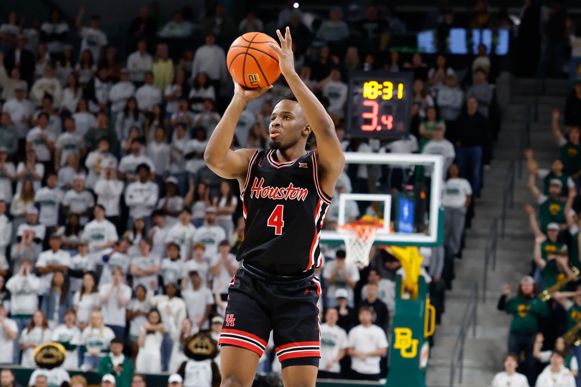 Houston Cougars guard L.J. Cryer (4) scores a three-point basket against the Baylor Bears during the first half at Paul and Alejandra Foster Pavilion.