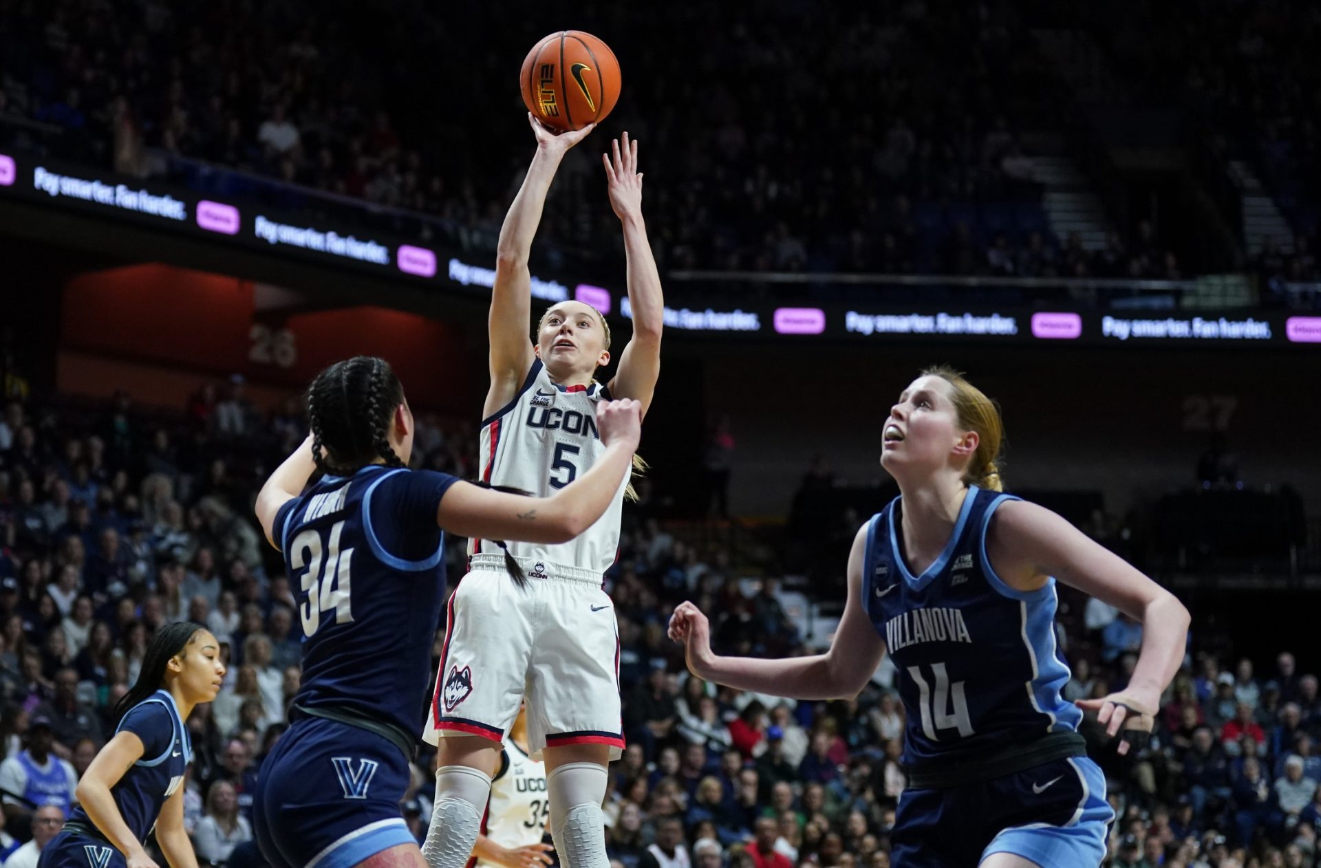 UConn Huskies guard Paige Bueckers (5) shoots the ball against Villanova Wildcats guard Maddie Webber (34) in the first half at Mohegan Sun Arena.