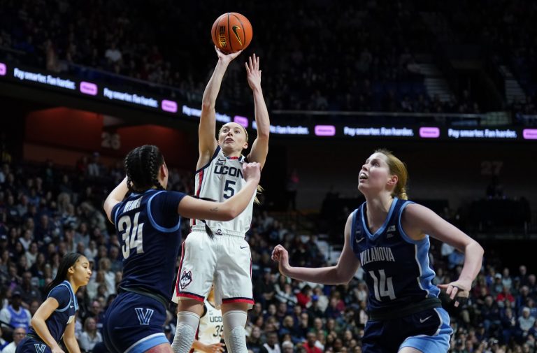 UConn Huskies guard Paige Bueckers (5) shoots the ball against Villanova Wildcats guard Maddie Webber (34) in the first half at Mohegan Sun Arena.