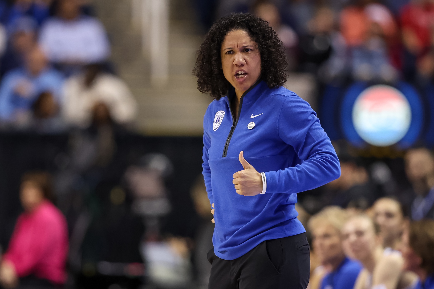 Duke Blue Devils head coach Kara Lawson gives a thumbs up to a player during the fourth quarter against NC State Wolfpack at First Horizon Coliseum.