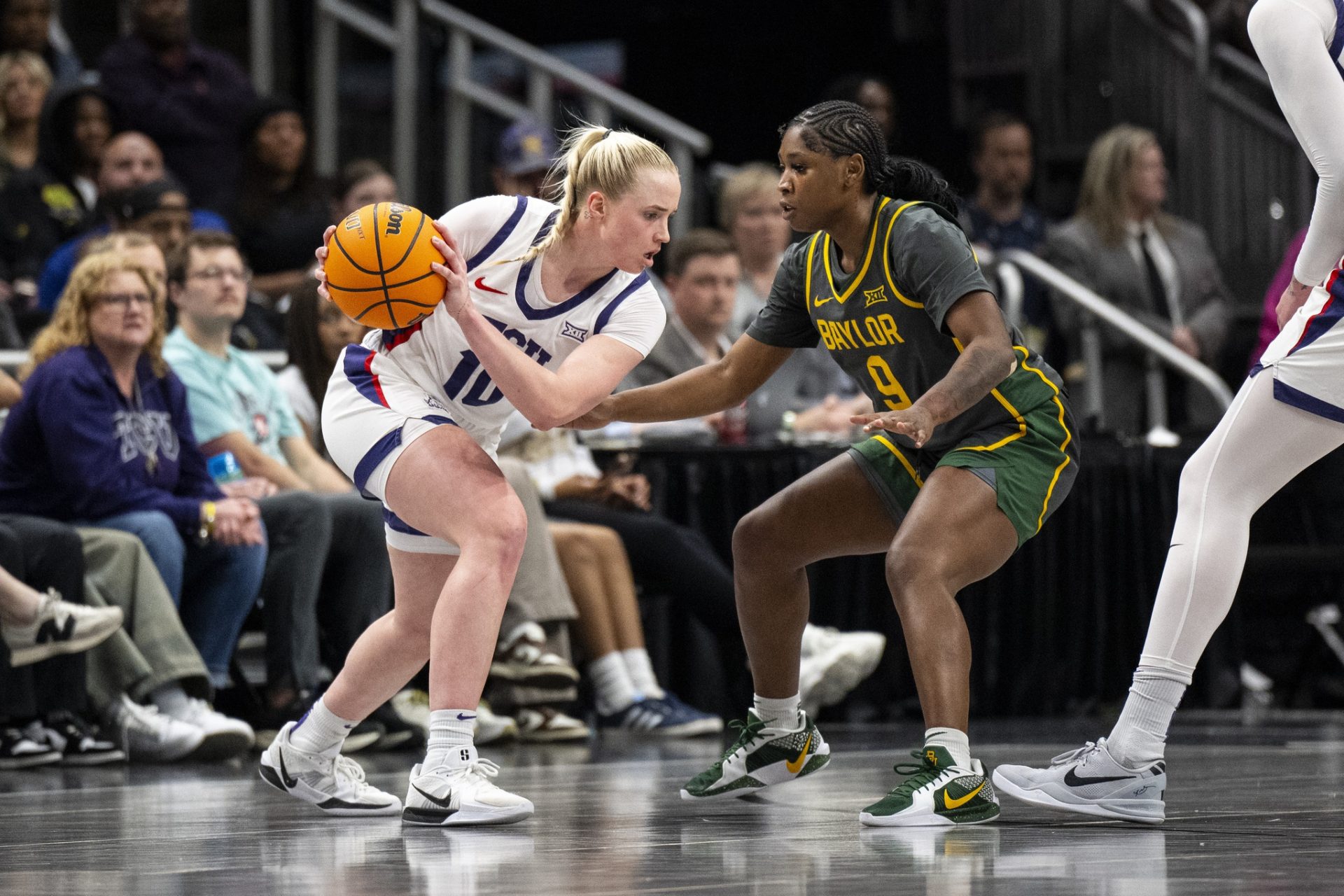 TCU Horned Frogs guard Hailey Van Lith (10) handles the ball while defended by Baylor Lady Bears guard Aliyah Matharu (9) during the second half at T-Mobile Center.