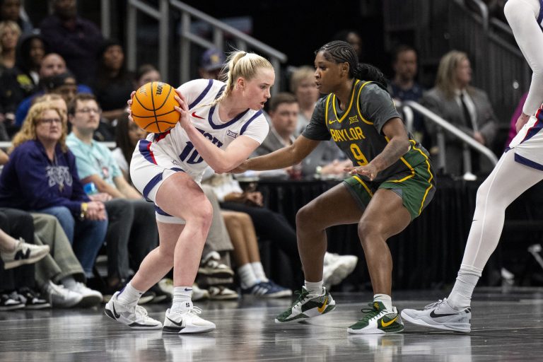 TCU Horned Frogs guard Hailey Van Lith (10) handles the ball while defended by Baylor Lady Bears guard Aliyah Matharu (9) during the second half at T-Mobile Center.