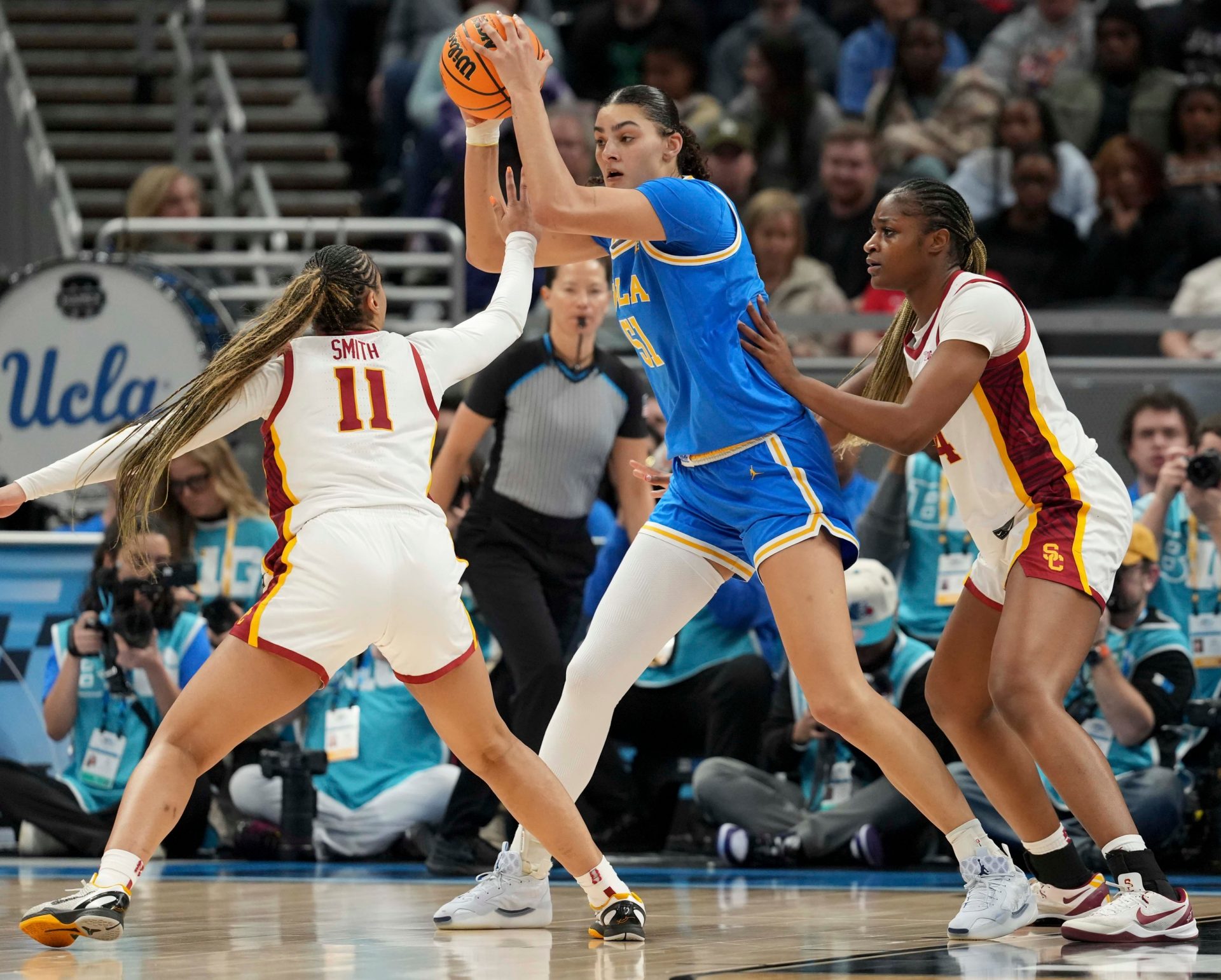 USC Trojans guard Kennedy Smith (11) and center Clarice Akunwafo (34) guard UCLA Bruins center Lauren Betts (51) during the second half of the 2025 TIAA Big Ten Women's Basketball Tournament final game on Sunday, March 9, 2025, at Gainbridge Fieldhouse in Indianapolis. UCLA defeated USC 72-67.