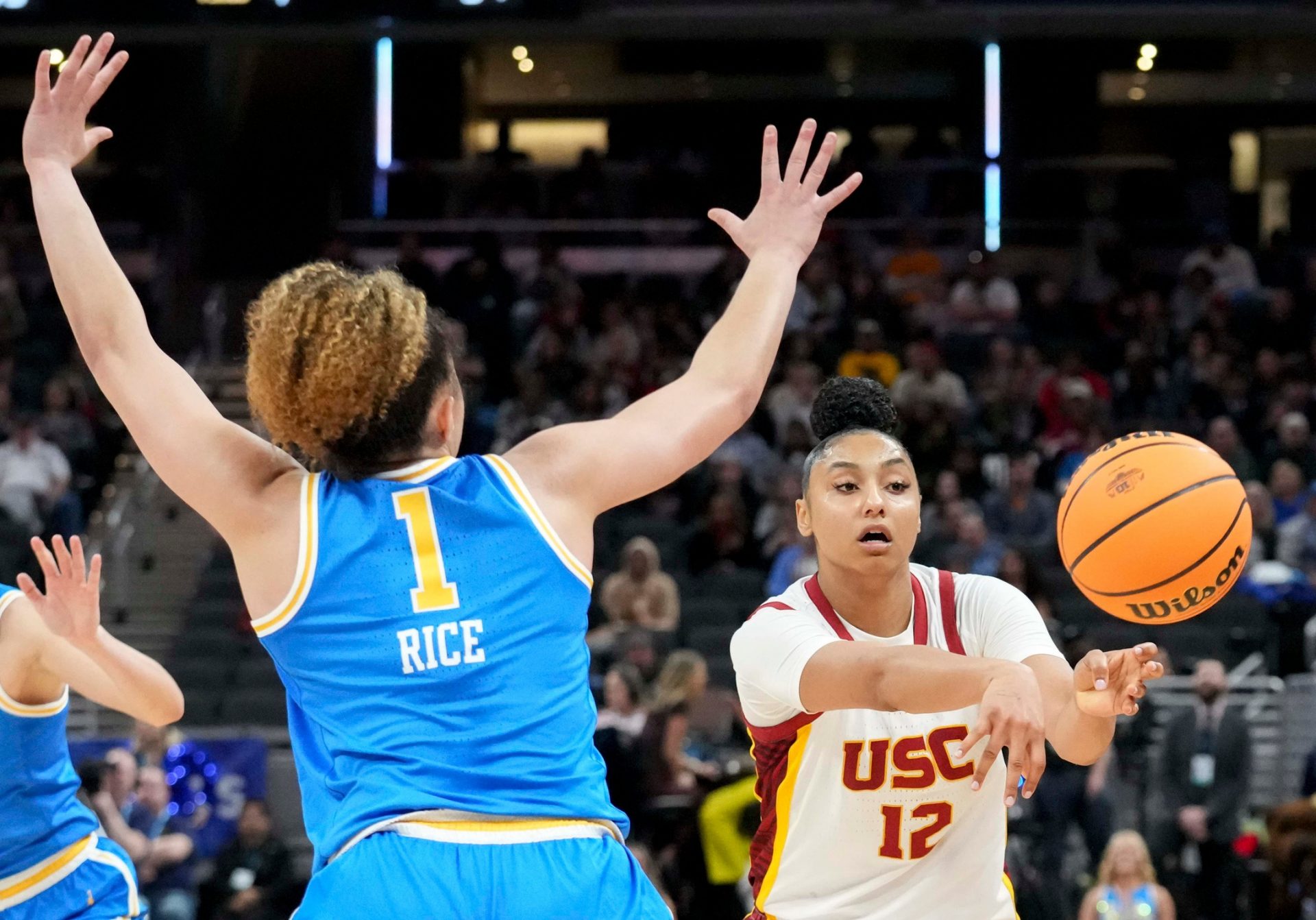 UCLA Bruins guard Kiki Rice (1) guards USC Trojans guard JuJu Watkins (12) as she passes the ball during the second half of the 2025 TIAA Big Ten Women's Basketball Tournament final game on Sunday, March 9, 2025, at Gainbridge Fieldhouse in Indianapolis. UCLA defeated USC 72-67.