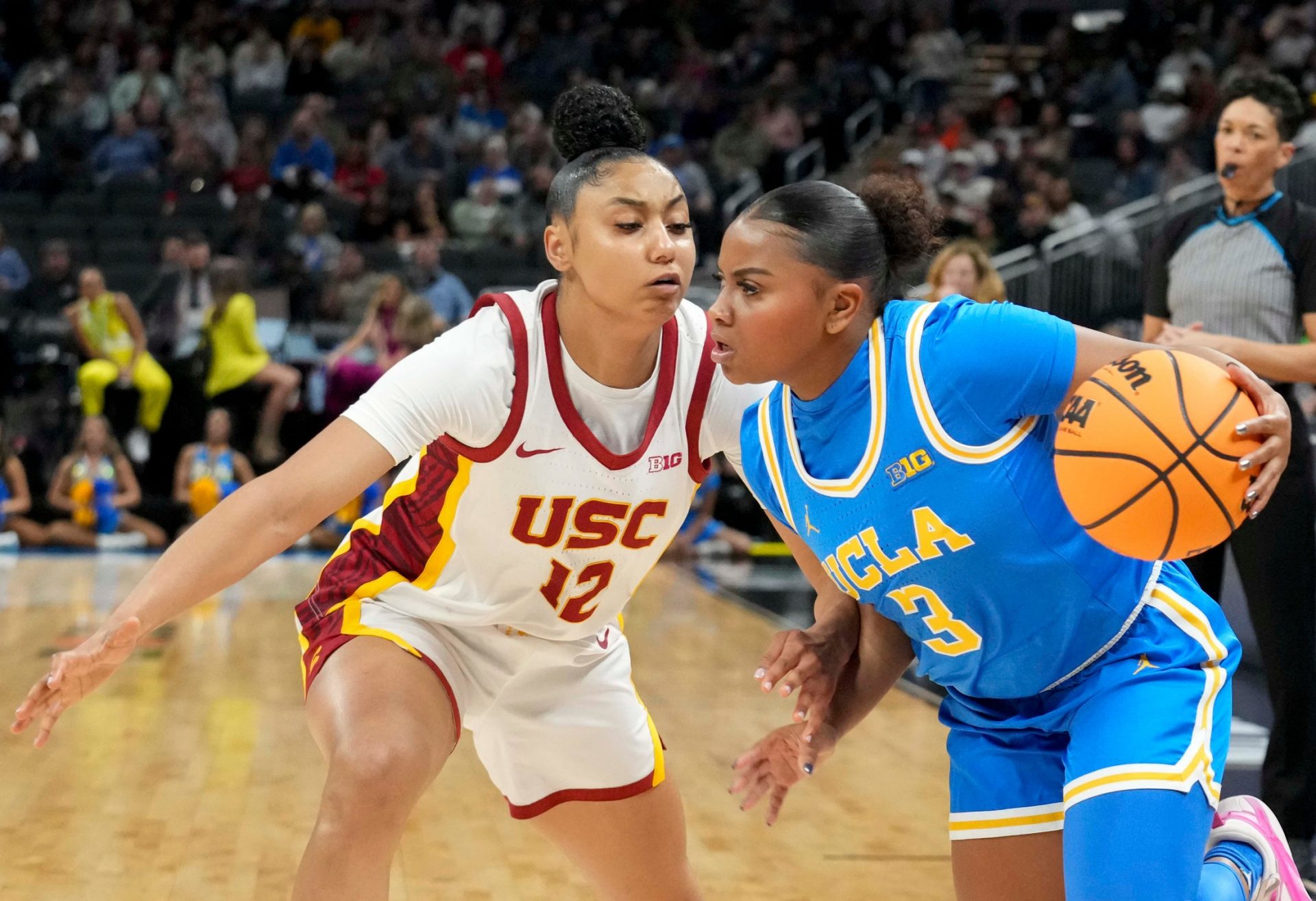 USC Trojans guard JuJu Watkins (12) guards UCLA Bruins guard Londynn Jones (3) during the first half of the 2025 TIAA Big Ten Women's Basketball Tournament final game on Sunday, March 9, 2025, at Gainbridge Fieldhouse in Indianapolis. UCLA defeated USC 72-67.