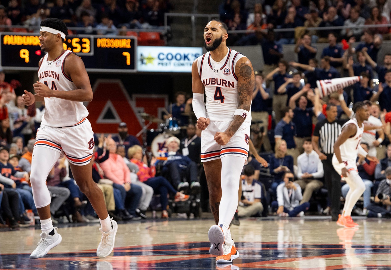 Auburn Tigers forward Johni Broome (4) celebrates a three-pointer as Auburn Tigers take on Missouri Tigers at Neville Arena in Auburn, Ala., on Saturday, Jan. 4, 2025.