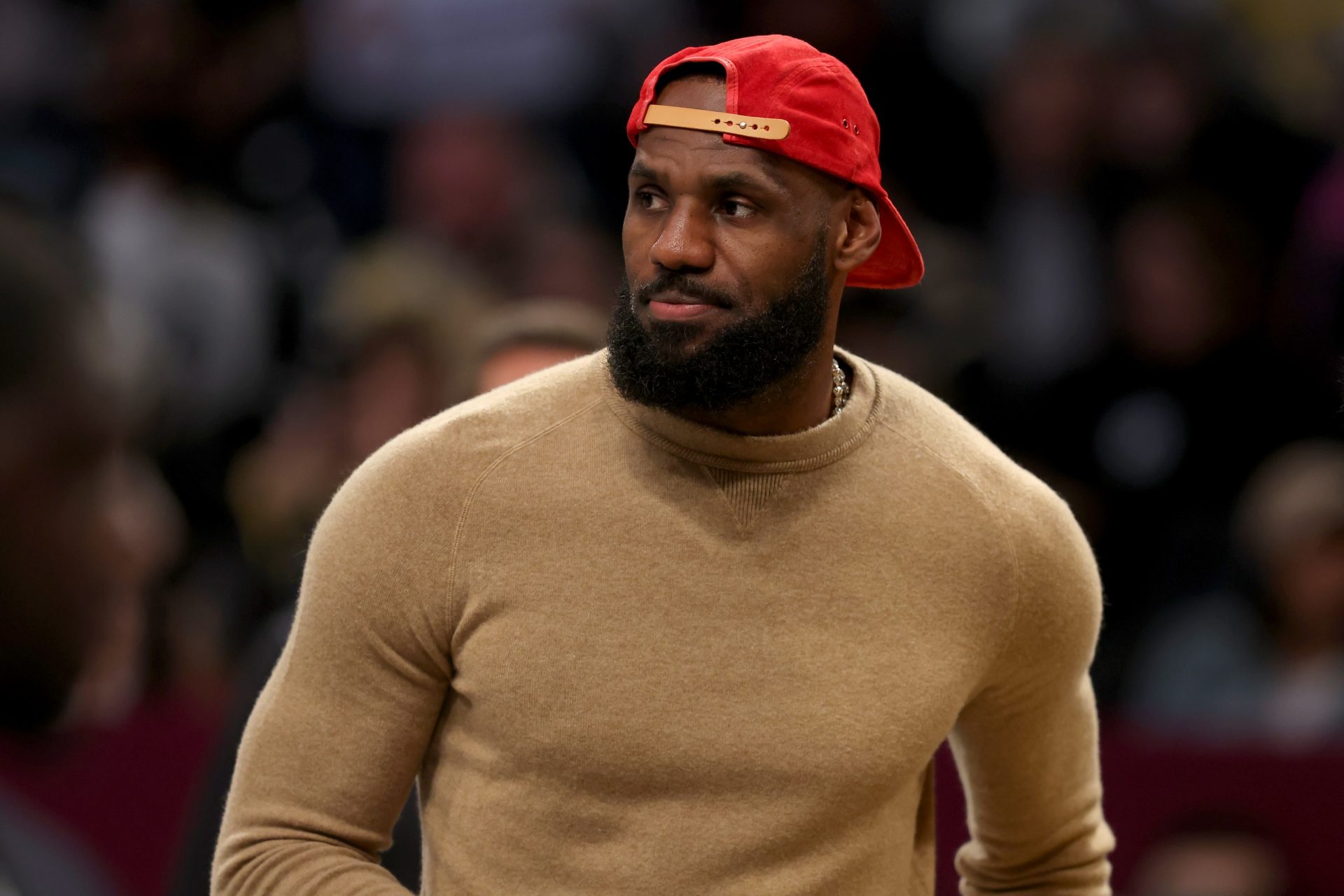 Los Angeles Lakers injured forward LeBron James (23) on the court during a time out during the first quarter against the Brooklyn Nets at Barclays Center.