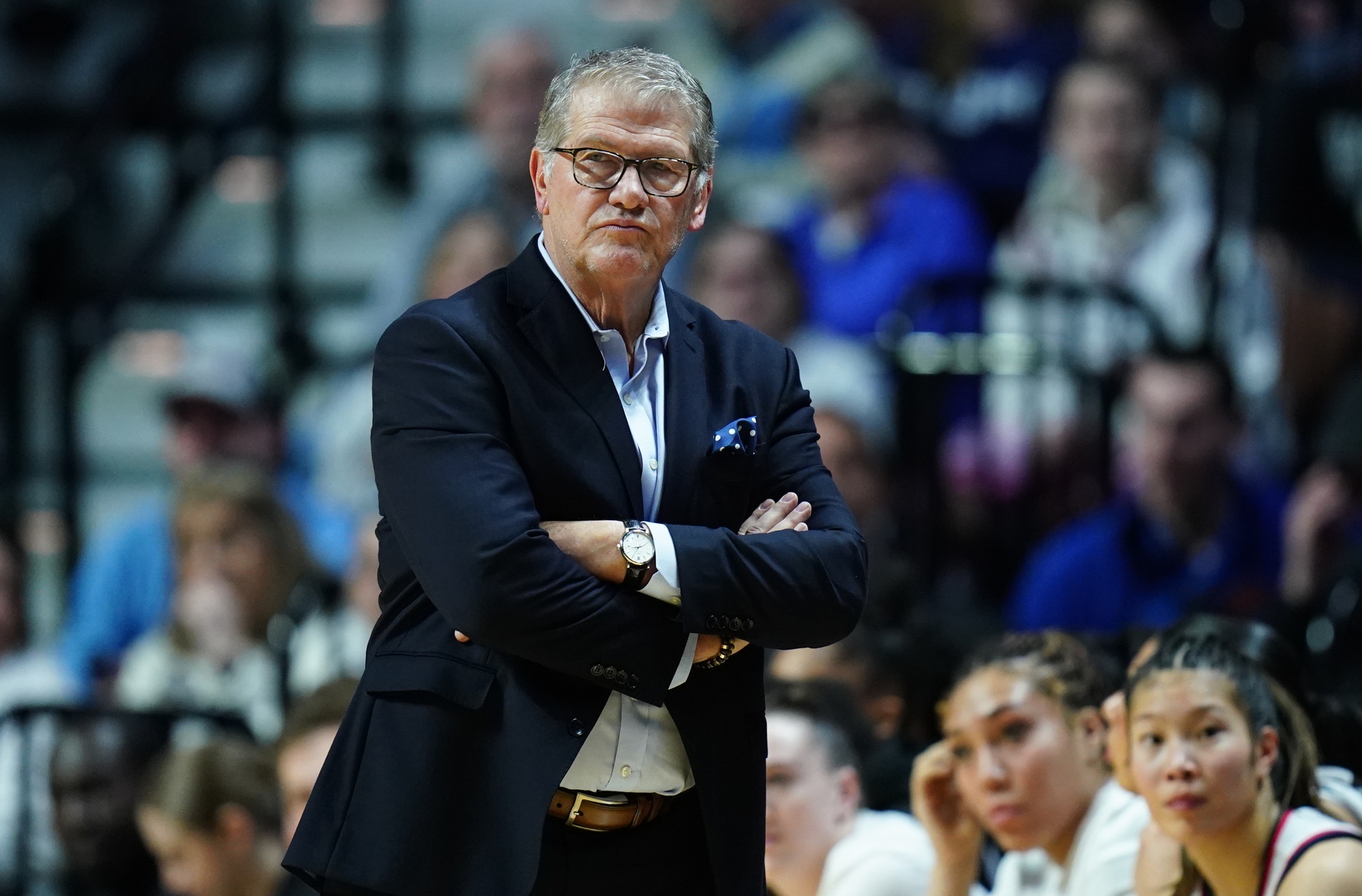 UConn Huskies head coach Geno Auriemma watches from the sideline as they take on the Creighton Bluejays at Mohegan Sun Arena.