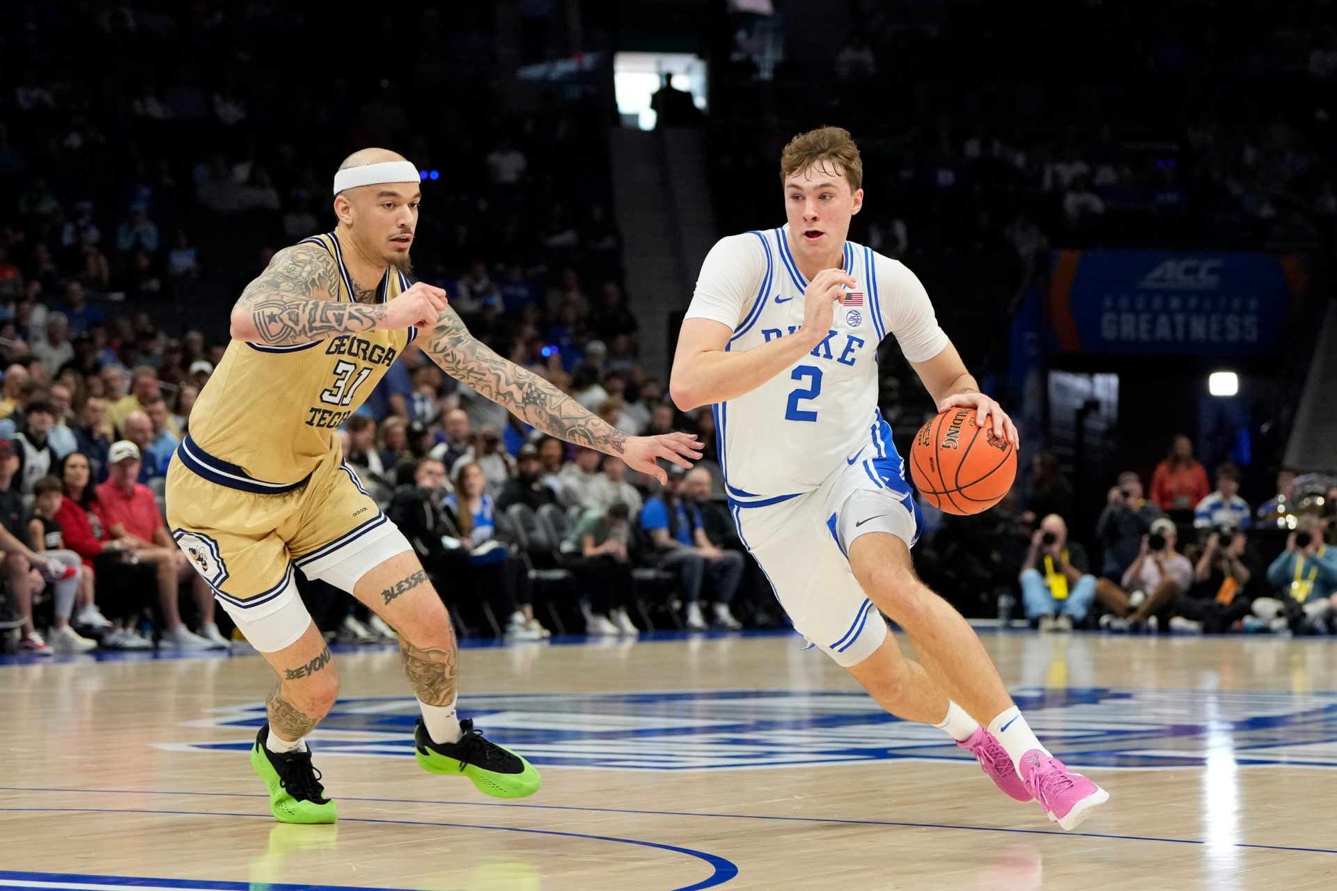 Duke Blue Devils forward Cooper Flagg (2) with the ball as Georgia Tech Yellow Jackets forward Duncan Powell (31) defends in the first half at Spectrum Center.