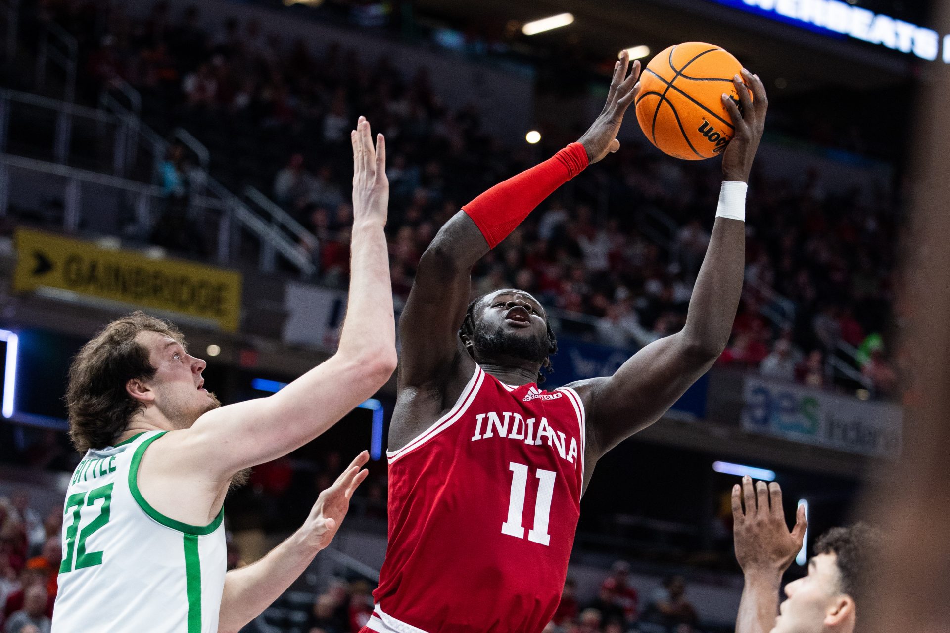 Indiana Hoosiers center Oumar Ballo (11) shoots the ball while Oregon Ducks center Nate Bittle (32) defends in the first half at Gainbridge Fieldhouse.