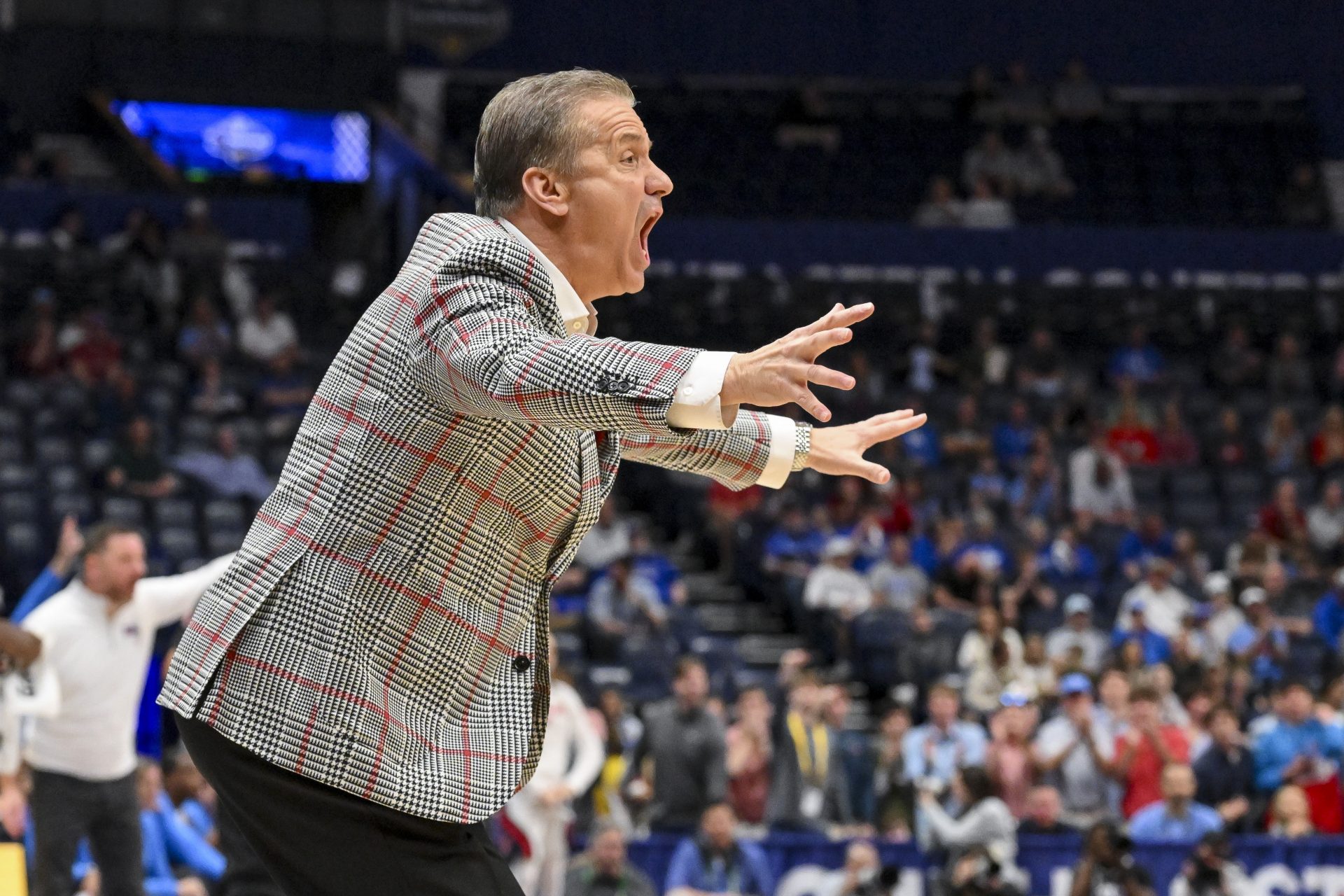 Arkansas Razorbacks head coach John Calipari screams to his team against the Mississippi Rebels during the first half at Bridgestone Arena.