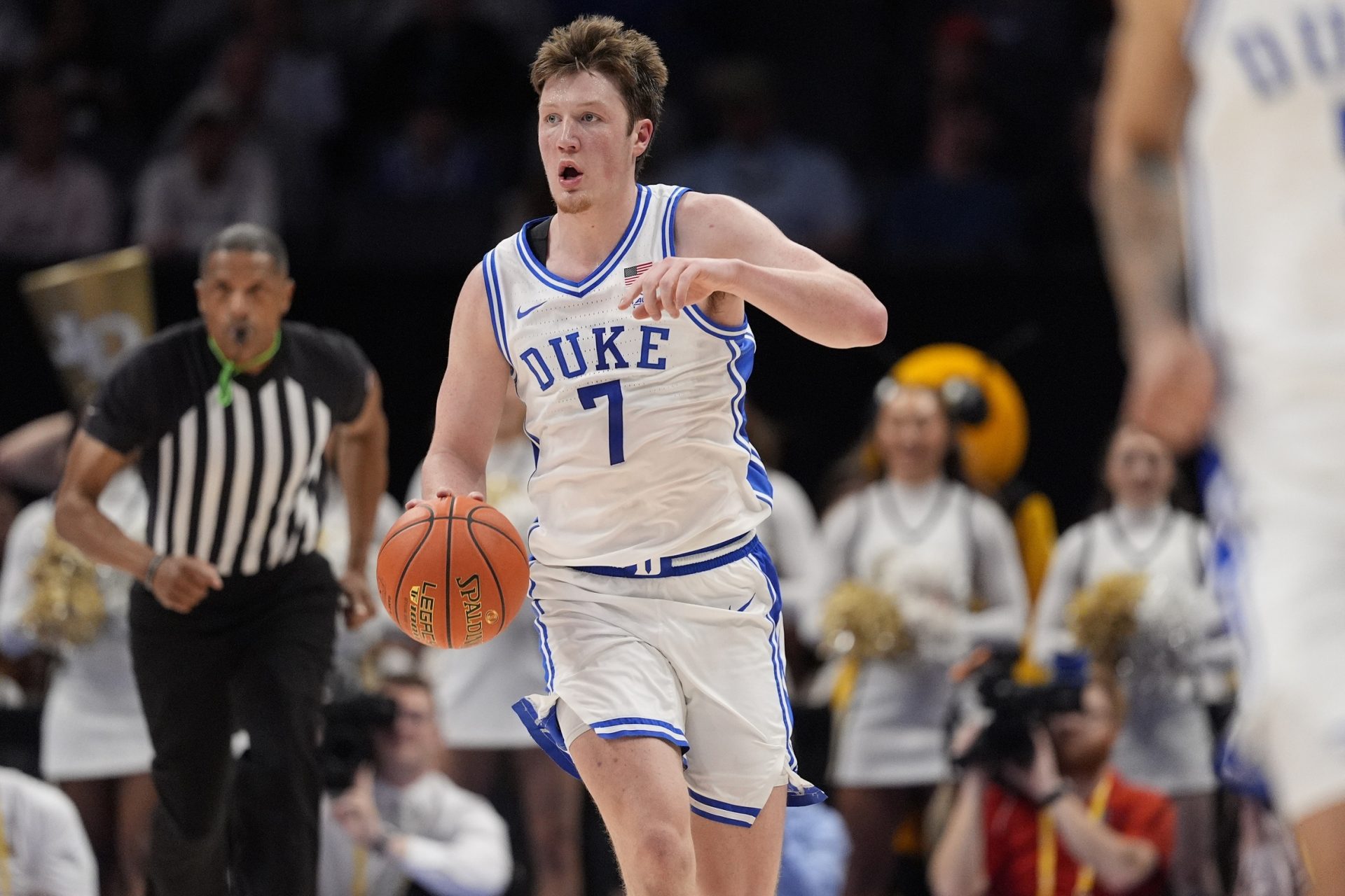 Duke Blue Devils guard Kon Knueppel (7) brings the ball up court against the Georgia Tech Yellow Jackets during the second half at Spectrum Center.