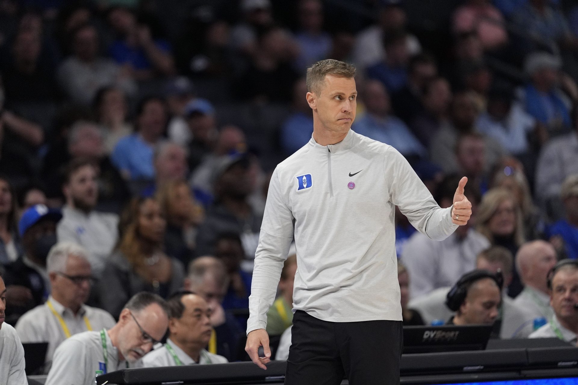 Duke Blue Devils head coach Jon Scheyer gives a thumbs up to his offense against the Georgia Tech Yellow Jackets during the second half at Spectrum Center.