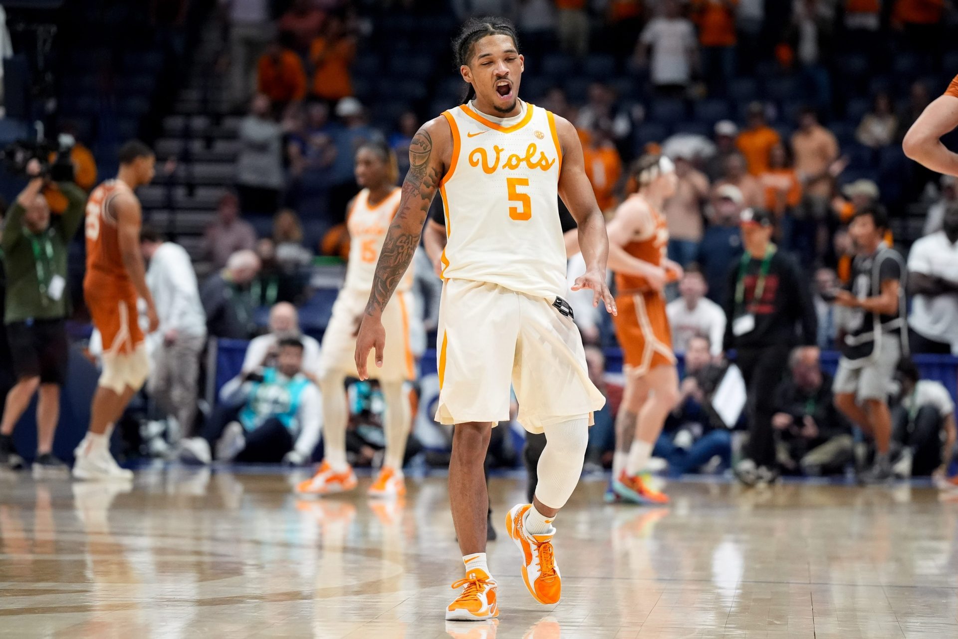 Tennessee guard Zakai Zeigler (5) celebrates defeating Texas in a Southeastern Conference tournament quarterfinal game at Bridgestone Arena in Nashville, Tenn., Friday, March 14, 2025.