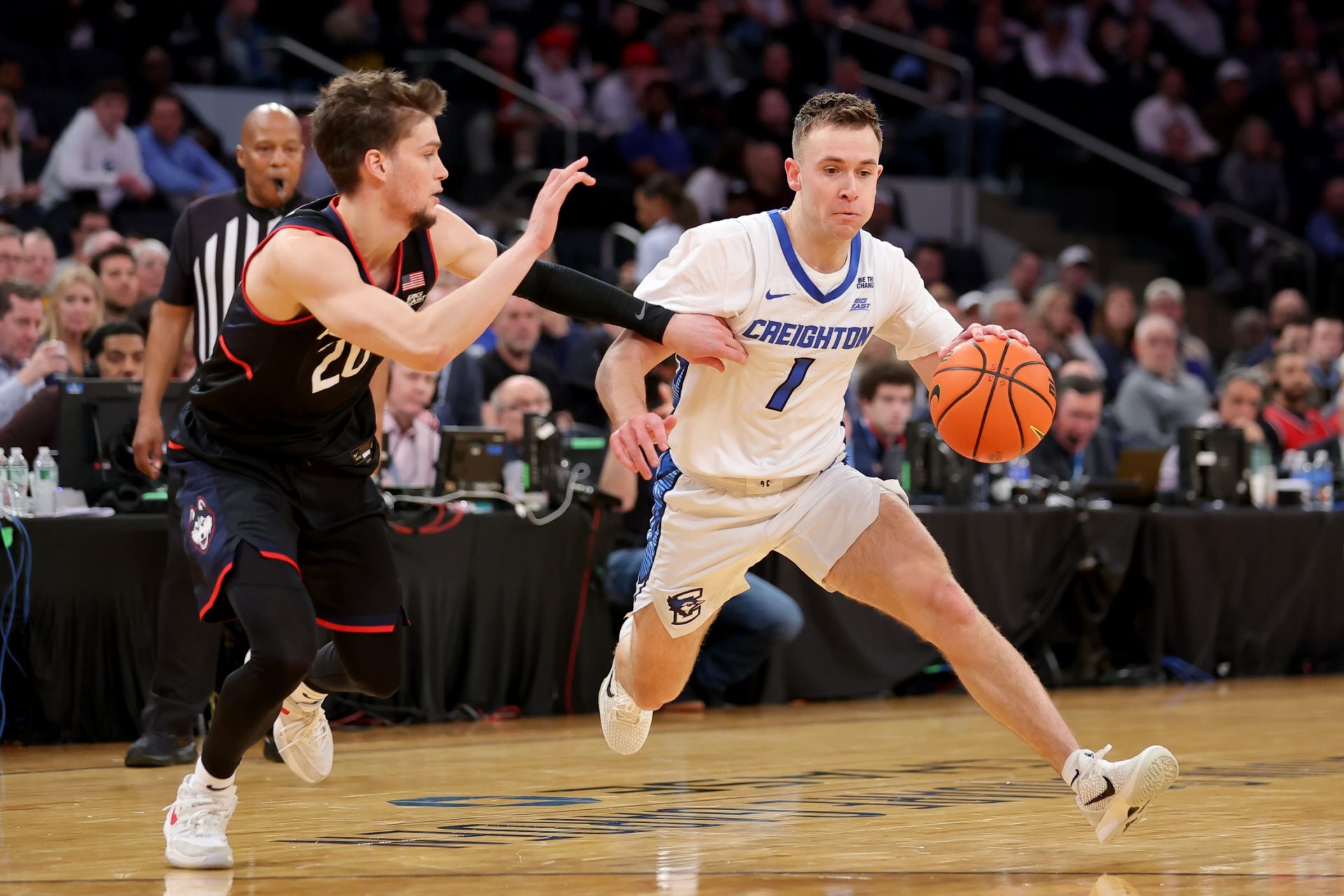 Creighton Bluejays guard Steven Ashworth (1) drives to the basket against Connecticut Huskies guard Aidan Mahaney (20) during the second half at Madison Square Garden.