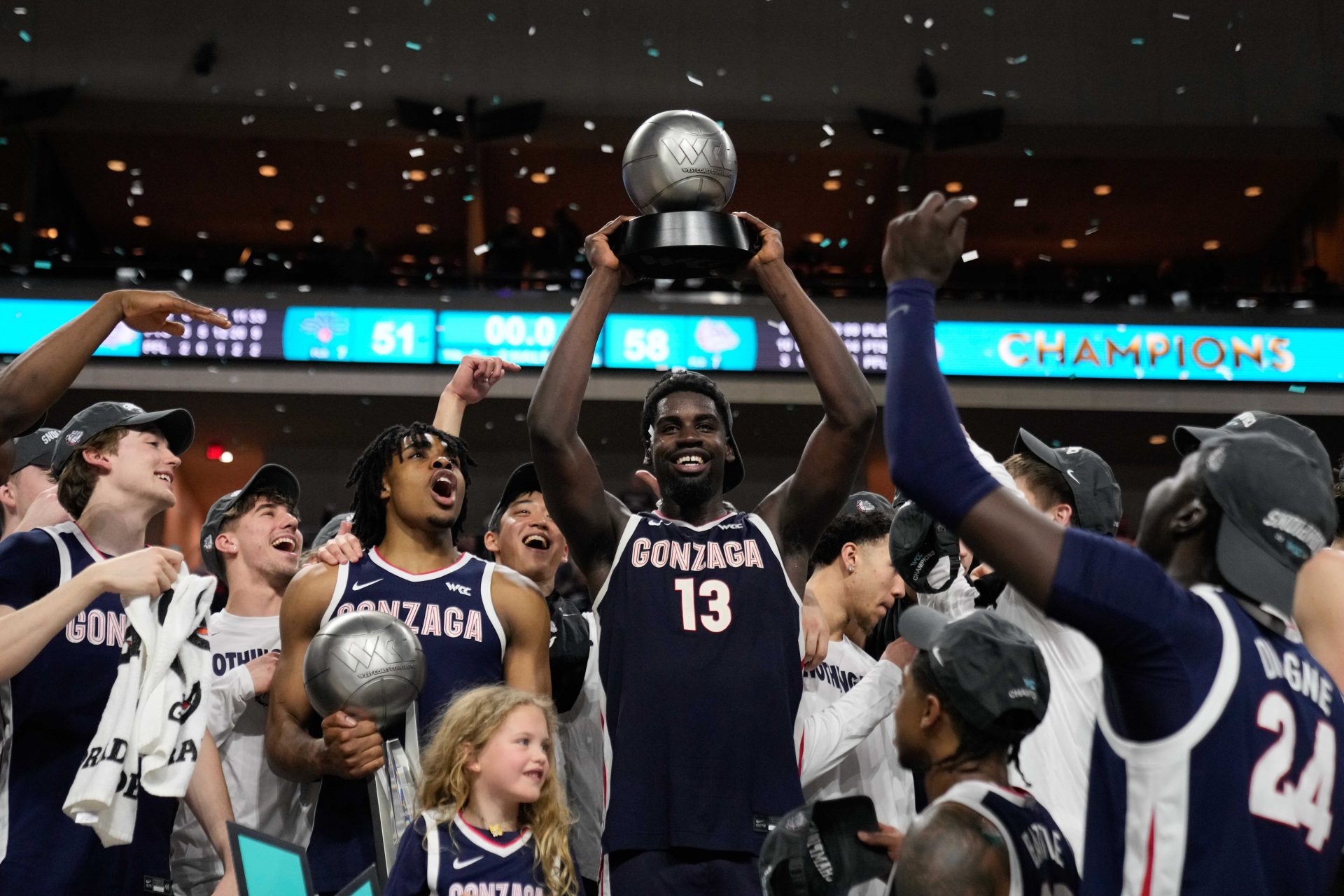 Gonzaga Bulldogs forward Graham Ike (13) hoists the Most Outstanding Player award after the game in the final of the West Coast