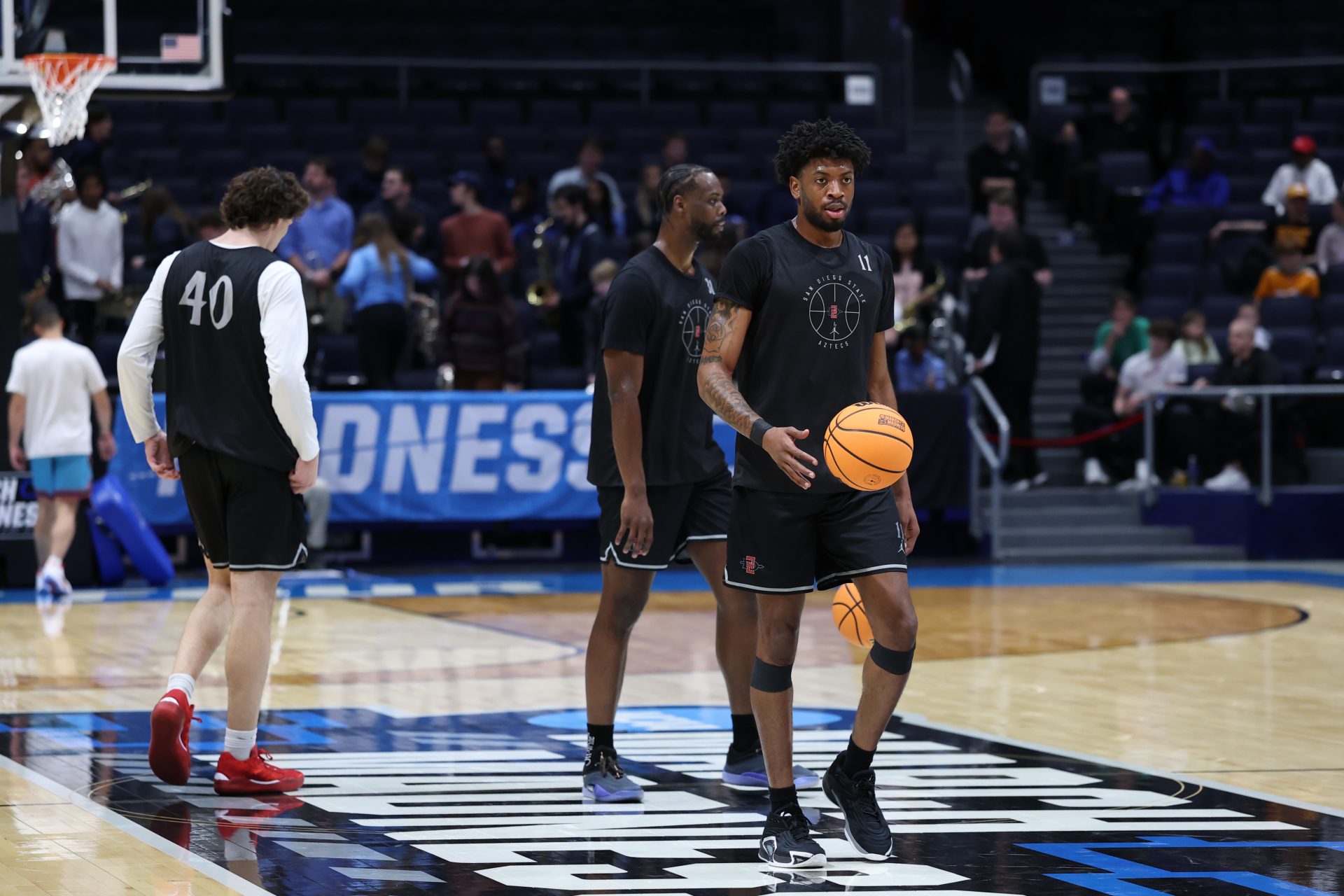 San Diego State Aztecs forward Demarshay Johnson Jr. (11) dribbles during the First Four Practice at UD Arena.