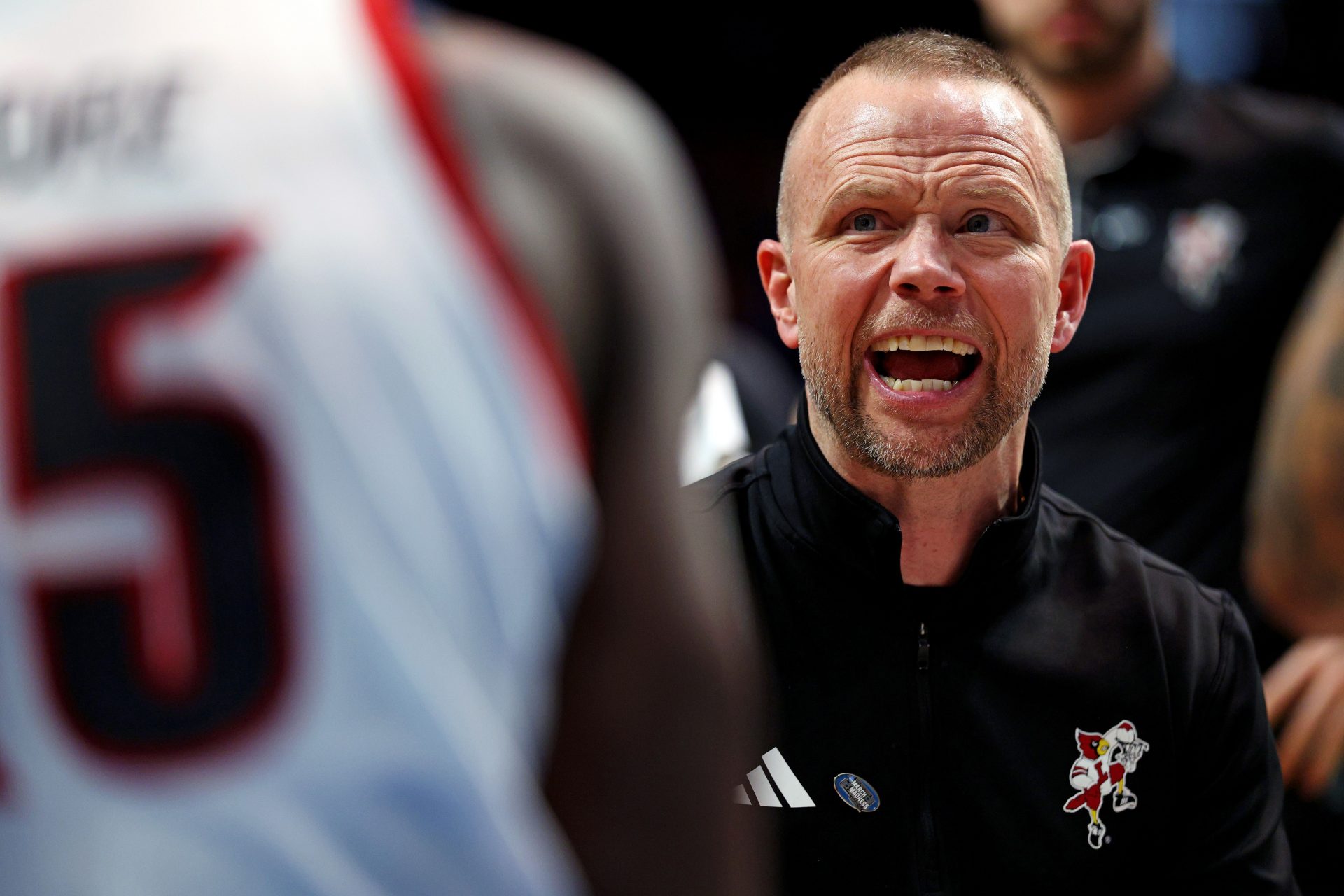 Louisville Cardinals head coach Pat Kelsey talks to his team in a time out during the second half against the Creighton Bluejays in the first round of the NCAA Tournament at Rupp Arena.