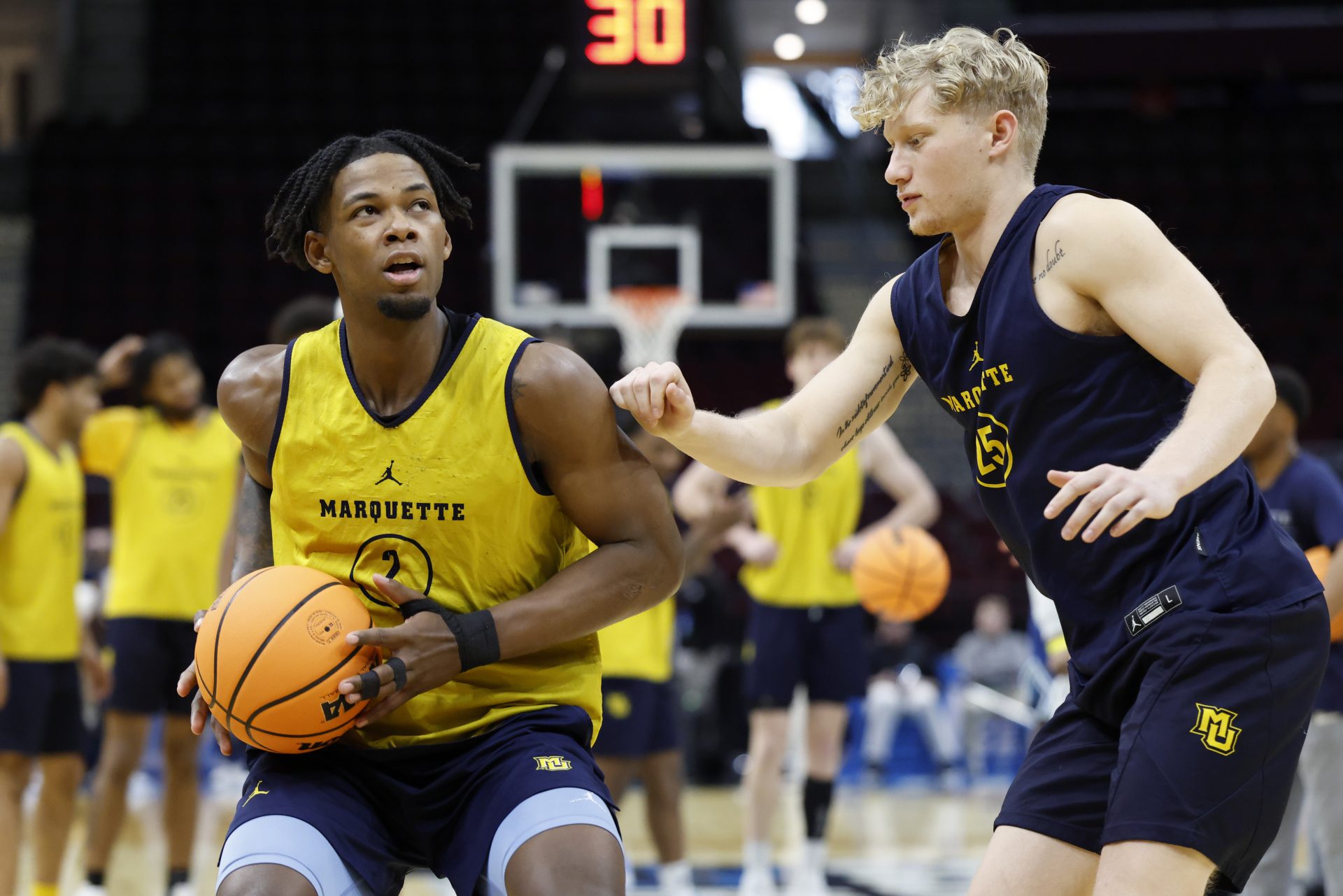 Marquette Golden Eagles guard Chase Ross (2) and guard Jack Anderson (25) practice during the NCAA Tournament First Round Practice at Rocket Arena.