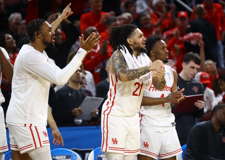 Houston Cougars guard Emanuel Sharp (21), guard L.J. Cryer (4) and the bench react in the second half of a first round men’s NCAA Tournament game against the SIU Edwardsville Cougars at Intrust Bank Arena.
