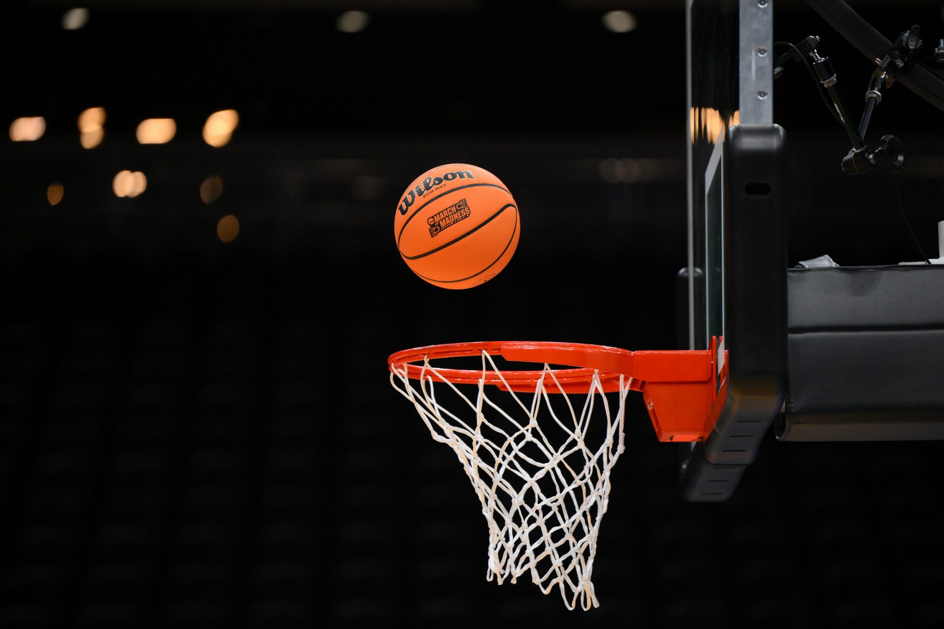 A Wilson practice basketball with the March Madness logo goes into the basket during the Maryland Terrapins practice at Climate Pledge Arena.