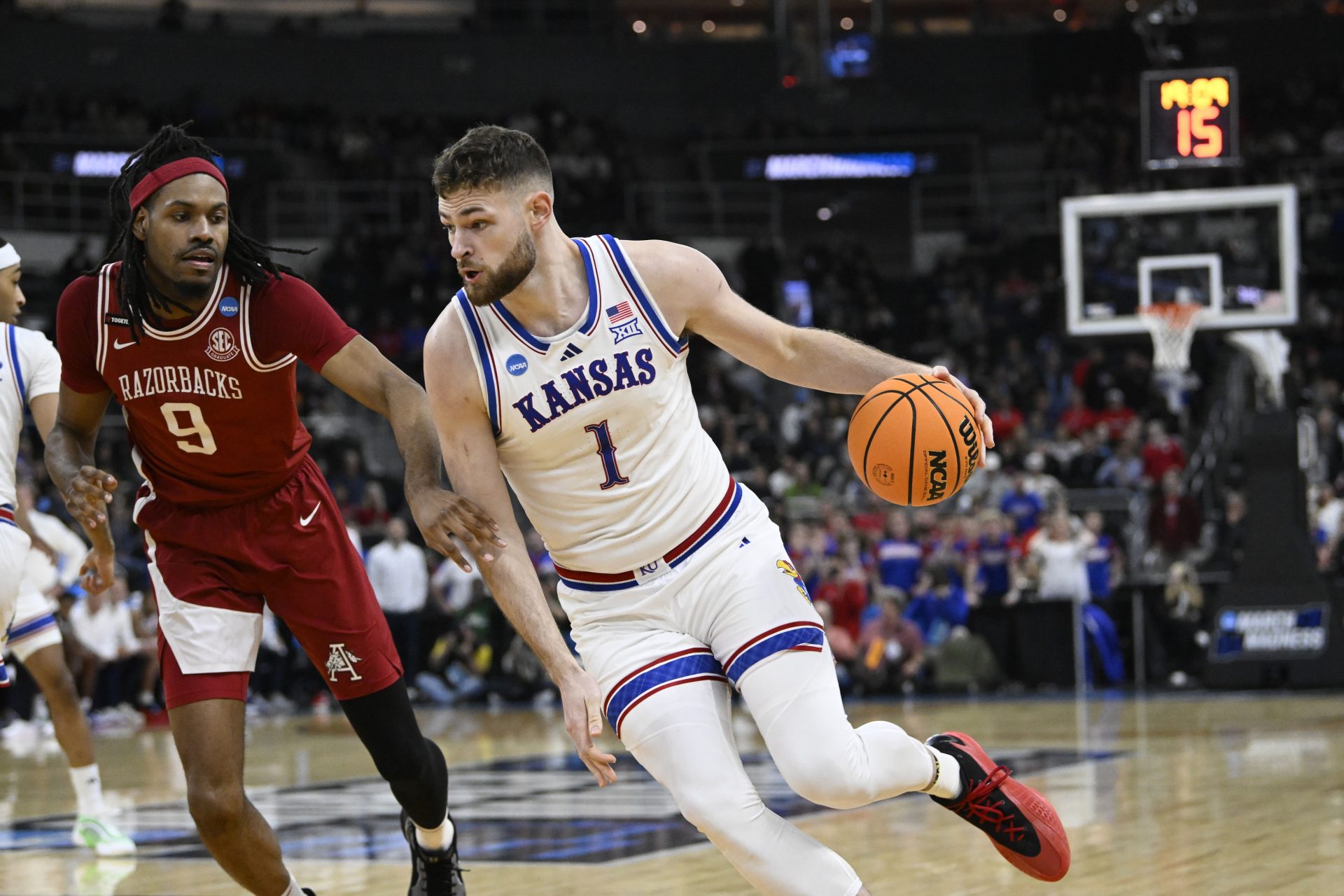 Kansas Jayhawks center Hunter Dickinson (1) controls the ball during the first quarter against Arkansas Razorbacks forward Jonas Aidoo (9) at Amica Mutual Pavilion.