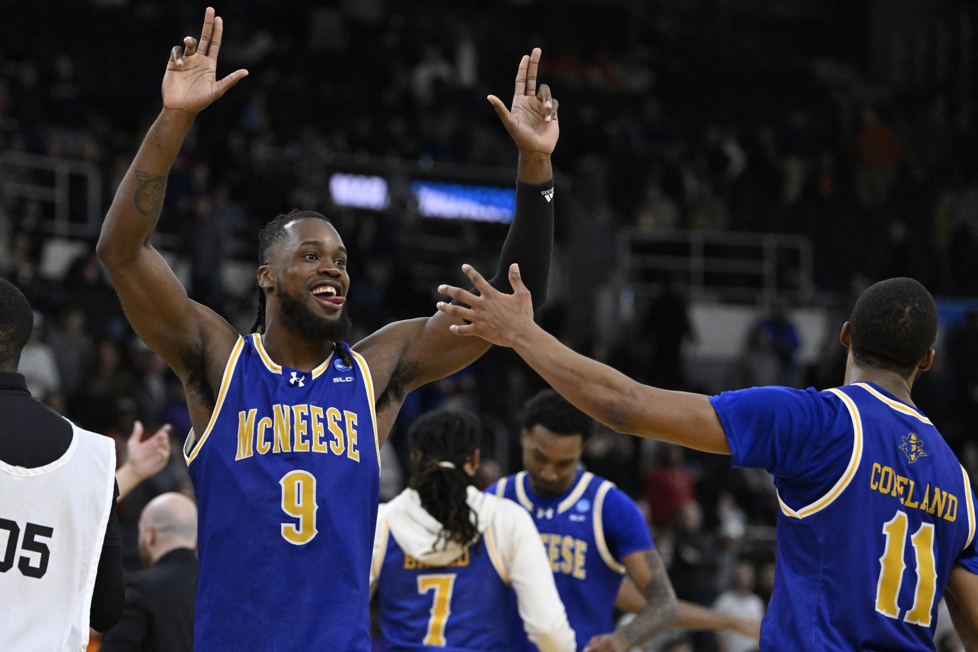 McNeese State Cowboys forward Christian Shumate (24) celebrates with guard Quadir Copeland (11) after defeating the Clemson Tigers at Amica Mutual Pavilion.