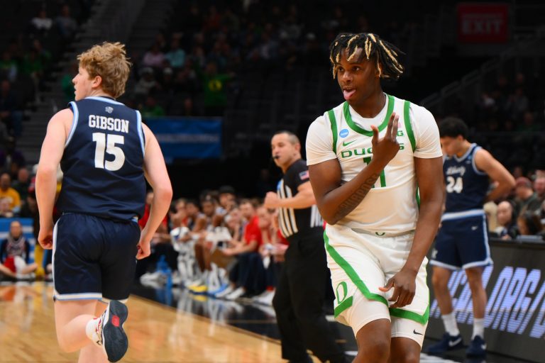 Oregon Ducks forward Mookie Cook (11) reacts against the Liberty Flames during the second half in the first round of the NCAA Tournament at Climate Pledge Arena.