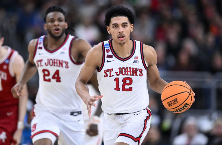 St. John's Red Storm guard RJ Luis Jr. (12) dribbles during the second half of a second round men’s NCAA Tournament game against the Arkansas