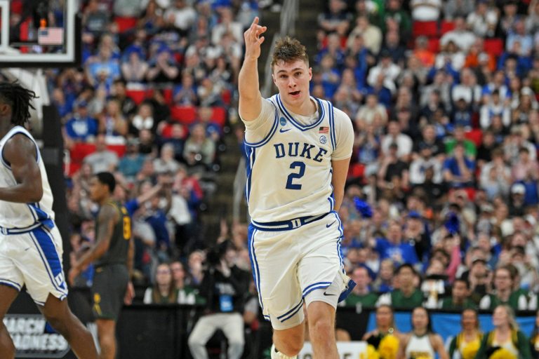 Duke Blue Devils forward Cooper Flagg (2) reacts after scoring a 3 pointer during the first half against the Baylor Bears in the second round of the NCAA Tournament at Lenovo Center.