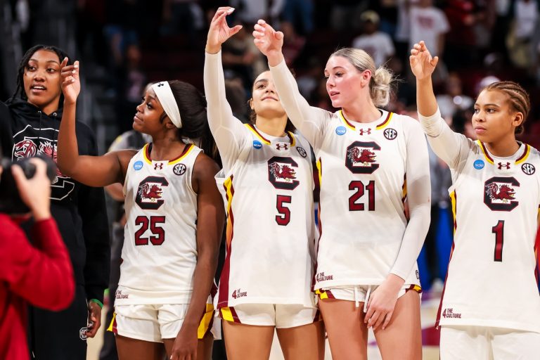 South Carolina Gamecocks forward Ashlyn Watkins (2), guard Raven Johnson (25), guard Tessa Johnson (5), forward Chloe Kitts (21) and guard Maddy McDaniel (1) celebrate following their win against the Indiana Hoosiers at Colonial Life Arena.