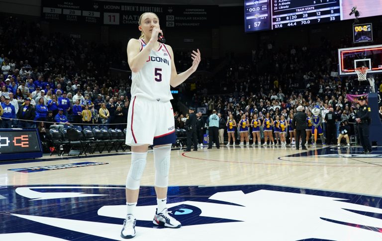 UConn Huskies guard Paige Bueckers (5) talks to the crowd after defeating the South Dakota State Jackrabbits at Harry A. Gampel Pavilion.
