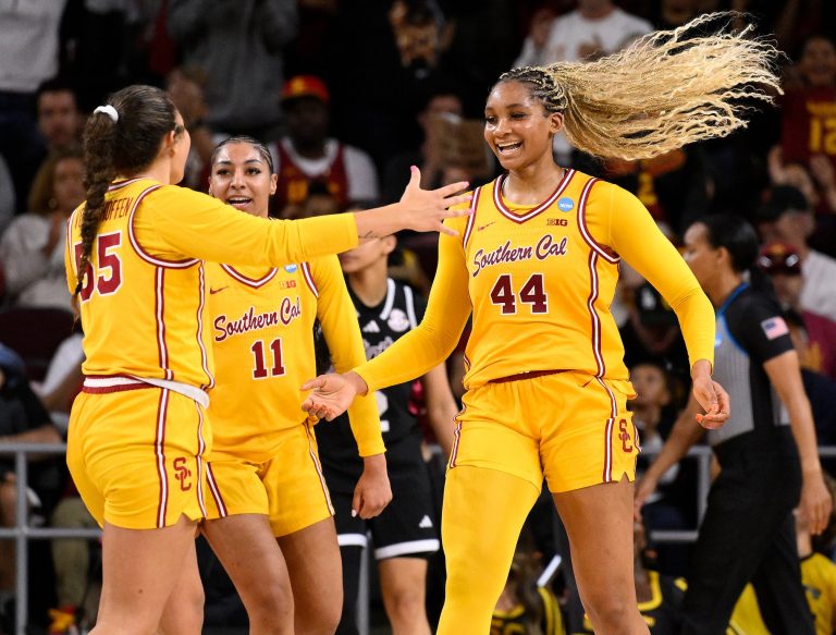 USC Trojans forward Kiki Iriafen (44) celebrates with Talia von Oelhoffen (55) and Kennedy Smith (11) after scoring in the third quarter against the Mississippi State Bulldogs during an NCAA Tournament second round game at Galen Center.