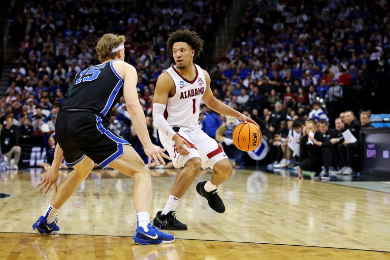 Alabama Crimson Tide guard Mark Sears (1) handles the ball against Brigham Young Cougars forward Richie Saunders (15) during the second half during an East Regional semifinal of the 2025 NCAA tournament at Prudential Center.