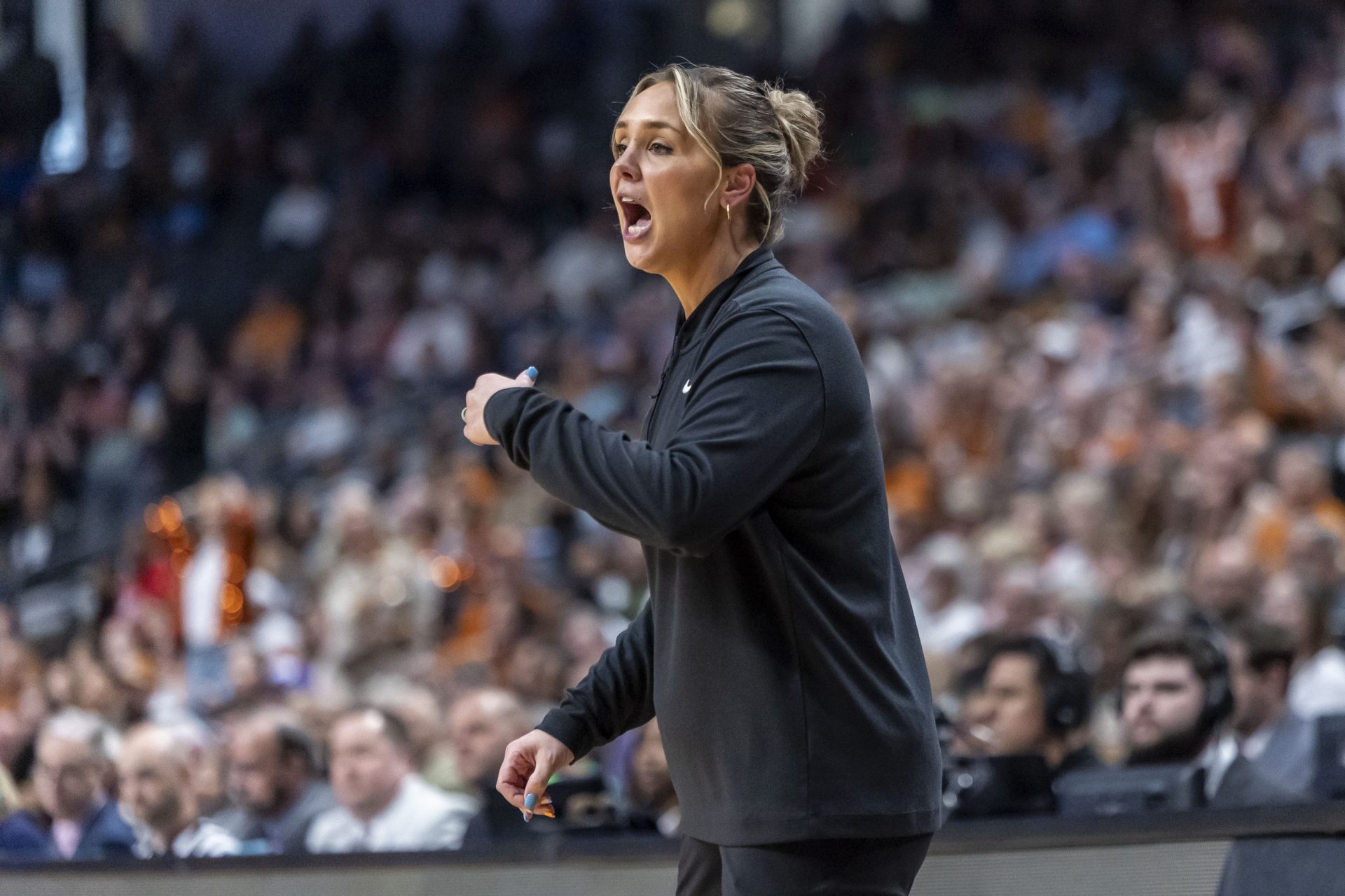 Tennessee Lady Vols head coach Kim Caldwell works with her team during the first half of a Sweet 16 NCAA Tournament basketball game against the Texas Longhorns at Legacy Arena. Mandatory Credit: Vasha
