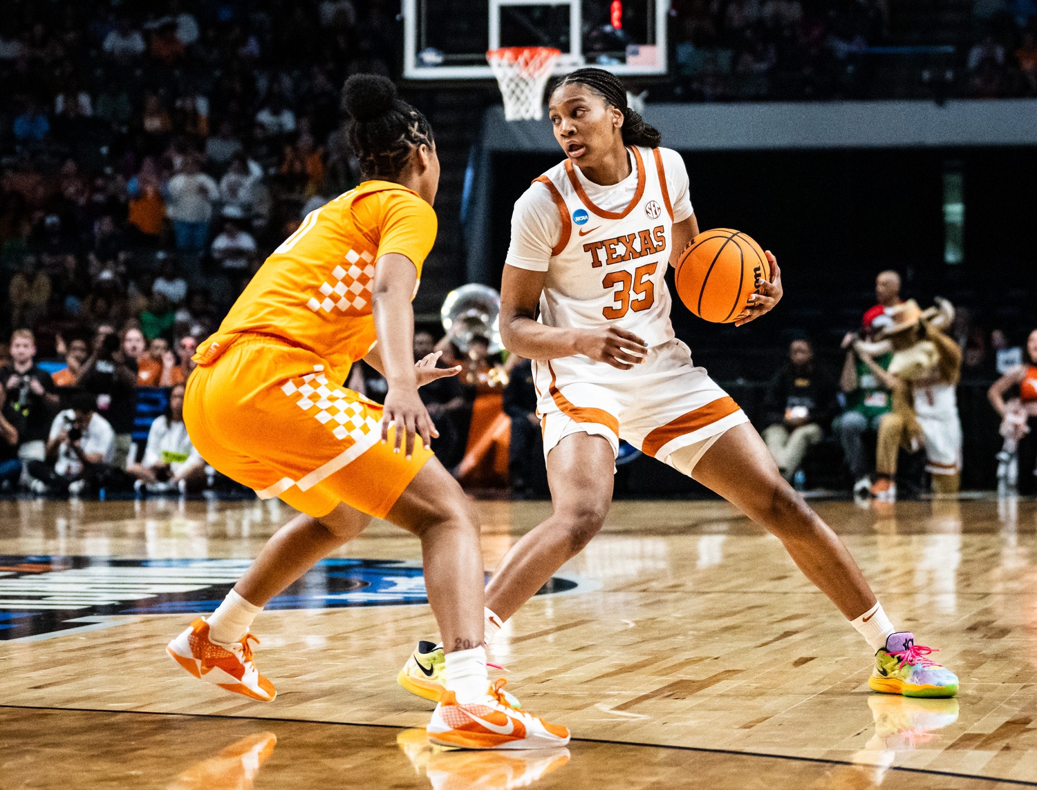 Texas Longhorns forward Madison Booker (35) searches for a way around defense in the first half of the Longhorns' NCAA Playoff Regional semi-final game against the Tennessee Lady Vols at Legacy Arena in Birmingham Alabama, March 29, 2025.