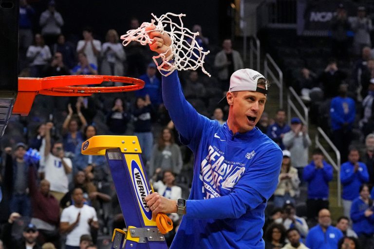 Duke Blue Devils head coach Jon Scheyer cuts down the net after the Duke Blue Devils beat the Alabama Crimson Tide in the East Regional final of the 2025 NCAA tournament at Prudential Center.