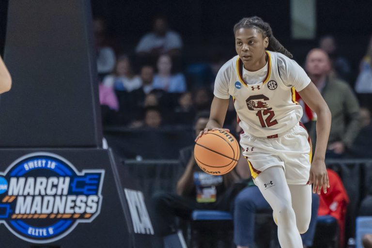 South Carolina Gamecocks guard MiLaysia Fulwiley (12) works the ball down the court against the Duke Blue Devils during the first half of an Elite 8 NCAA Tournament basketball game at Legacy Arena.