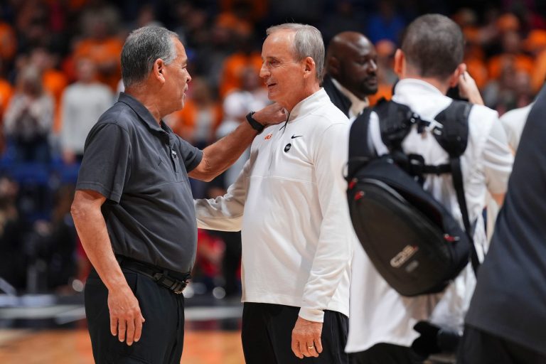 Tennessee head coach Rick Barnes and Houston head coach Kelvin Sampson chat before the start of their NCAA Tournament Elite Eight basketball game at Lucas Oil Stadium in Indianapolis, Ind., on Sunday, March 30, 2025.