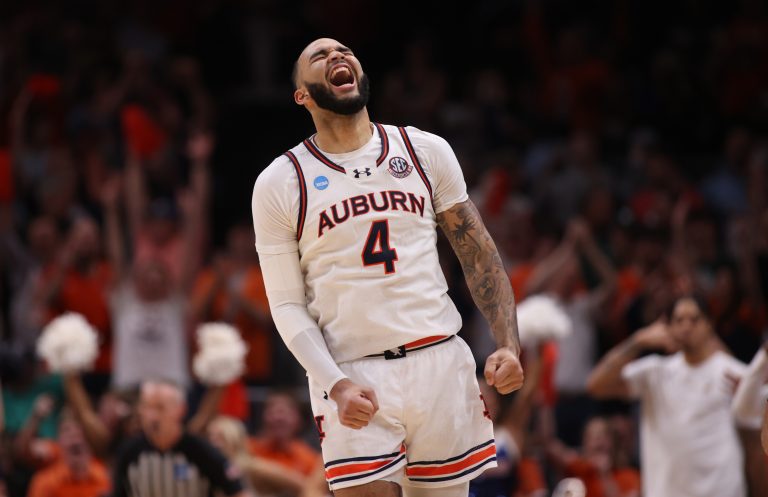 Auburn Tigers forward Johni Broome (4) celebrates after a play during the second half in the South Regional final of the 2025 NCAA tournament against the Michigan State Spartans at State Farm Arena.