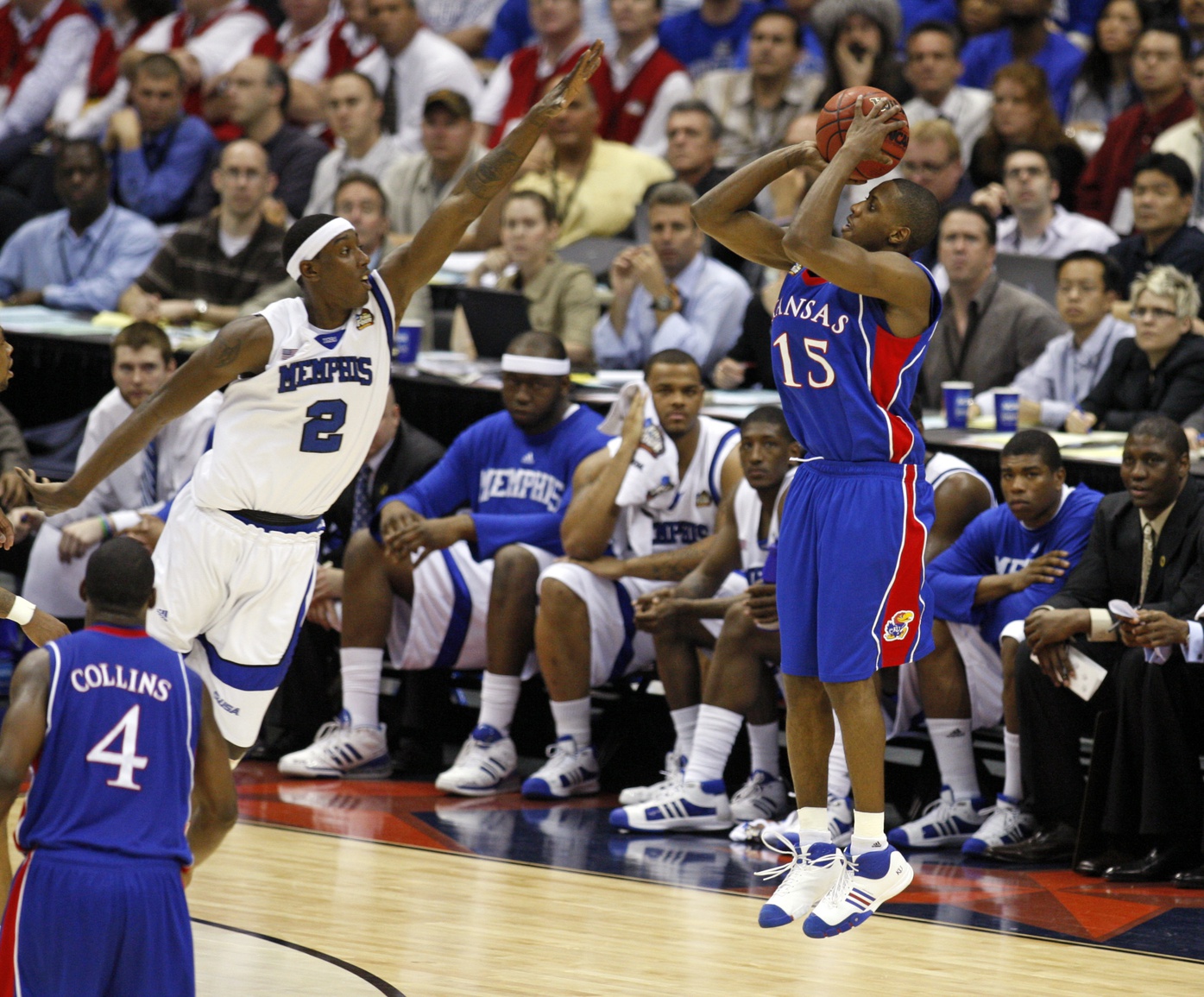 Kansas Jayhawks guard Mario Chalmers (15) shoots a three pointer over Memphis Tigers forward Robert Dozier (2) during the first half of the finals of the 2008 NCAA Mens Final Four Championship at the Alamodome.