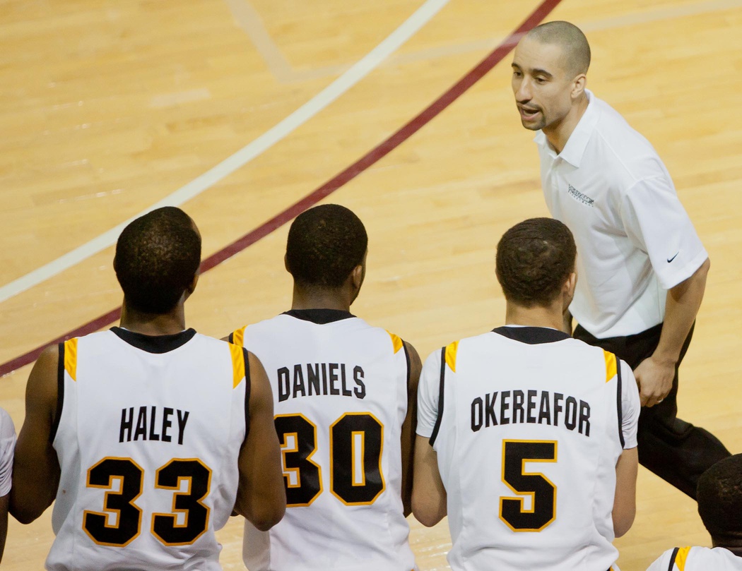 Virginia Commonwealth Rams head coach Shaka Smart talks to his players including center D.J. Haley (33) and guard Troy Daniels (30) and guard Teddy Okereafor (5) in the second half against the Western Kentucky Hilltoppers at TD Bank Arena.