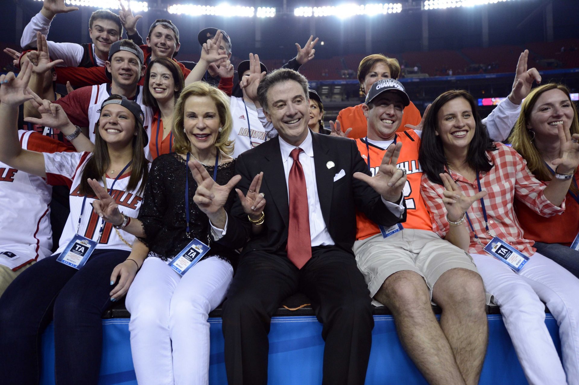 Louisville Cardinals head coach Rick Pitino (middle) poses with his family after the championship game in the 2013 NCAA mens Final Four against the Michigan Wolverines