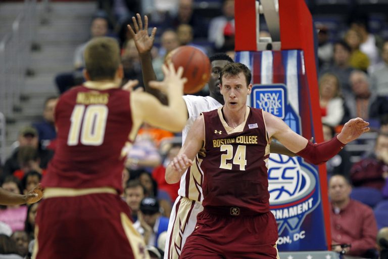 Boston College Eagles forward Ervins Meznieks (10) passes the ball to over Eagles center Dennis Clifford (24) against the Florida State Seminoles in the first half during round one of the ACC Conference tournament at Verizon Center. The Seminoles won 88-66.