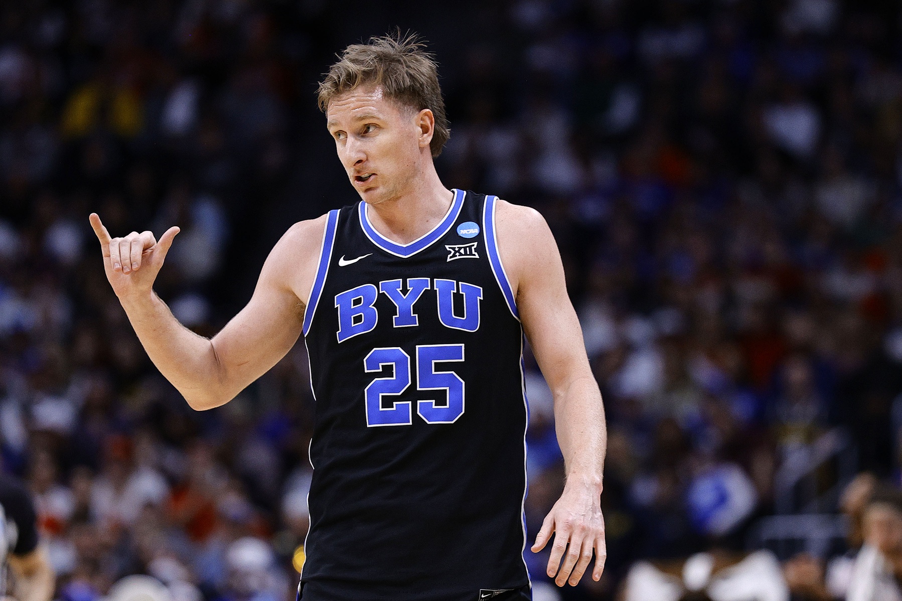 Brigham Young Cougars guard Dawson Baker (25) reacts against the Wisconsin Badgers during the second half in the second round of the NCAA Tournament at Ball Arena.